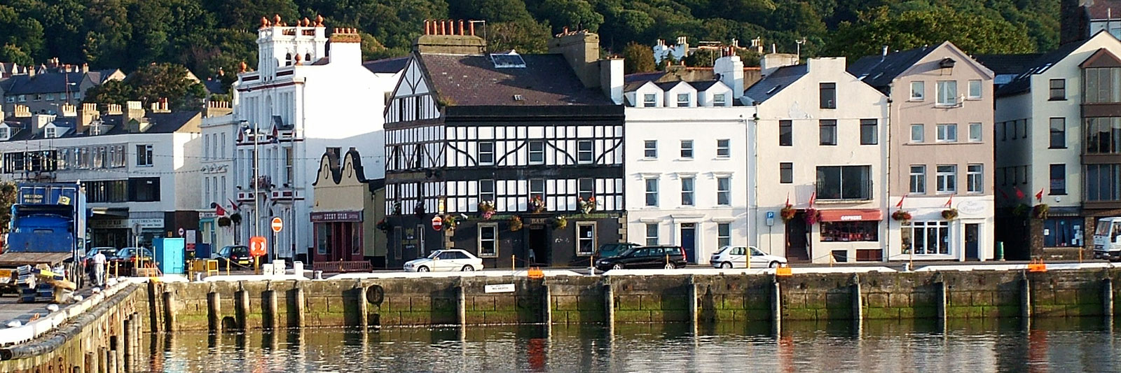 Panoramic view of Ramsey harbour with the shops and view of St Pauls Square